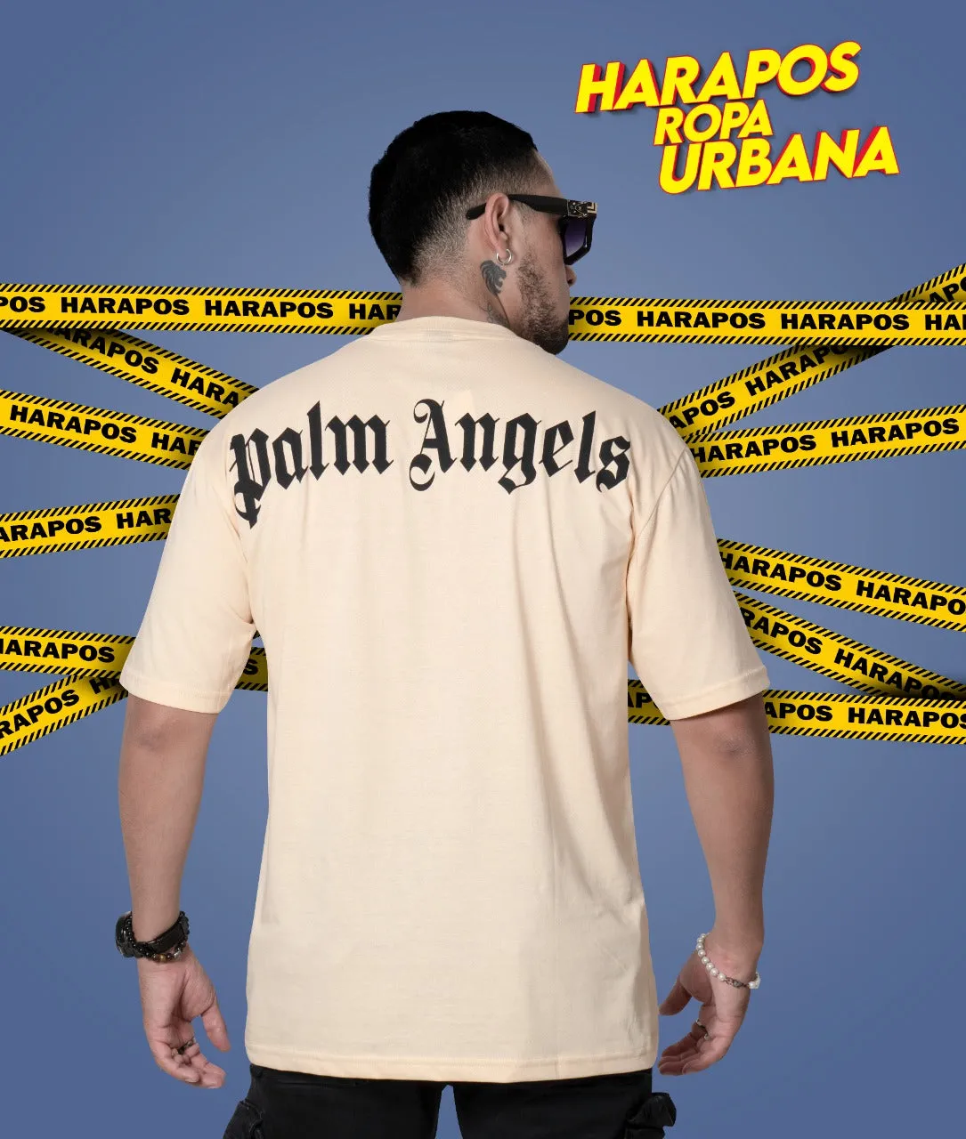 Polera ovsersize palm angels crema letras negras